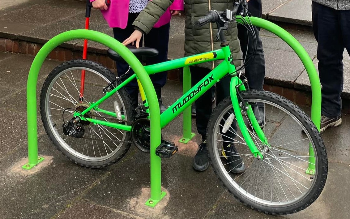 A bright green bike rack in Burntwood